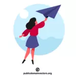 Donna che tiene un aeroplano di carta